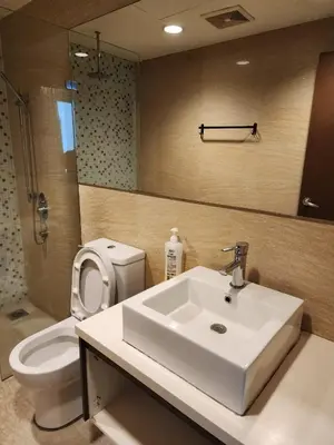 a bathroom with a sink and a toilet at Regalia Suites KL Infinity Pool _ by MygeHomes in Kuala Lumpur