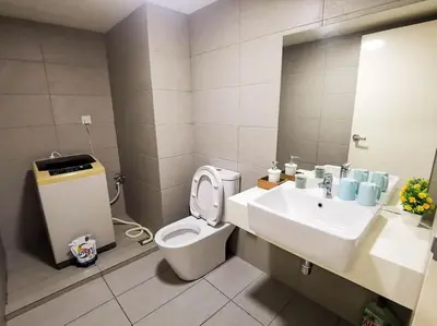 a bathroom with a sink and a toilet and a mirror at EkoCheras Loft 5 pax, #Snooker #AboveMall #Balcony #FreeCarPark in Kuala Lumpur