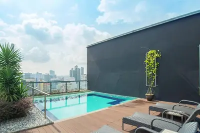 a swimming pool on the roof of a building at Bintang Fairlane 2mins PavilionKL TRX KLCC - AJhome in Kuala Lumpur