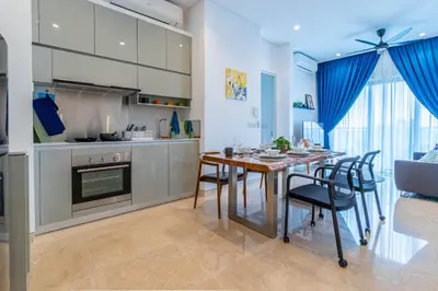 a kitchen and dining room with a table and chairs at Lucentia Residence BBCC By Bedstay in Kuala Lumpur