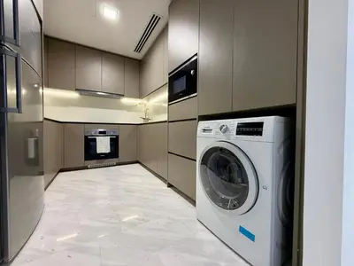 a laundry room with a washer and dryer in it at Eaton Residences KLCC in Kuala Lumpur