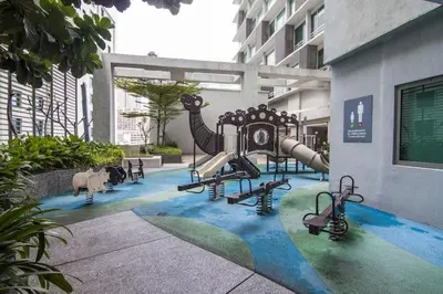 a playground in a building with a play equipment at SG Residence Bukit Bintang in Kuala Lumpur