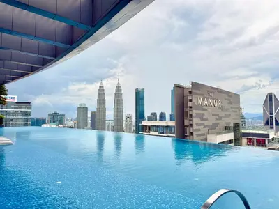 a large swimming pool on the roof of a building at EATON RESIDENCE AT KLCC in Kuala Lumpur
