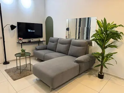 a living room with a couch and a tv at The Robertson S22 Jalan Alor Petaling Street Bukit Bintang KL 3R2B 8Pax in Kuala Lumpur