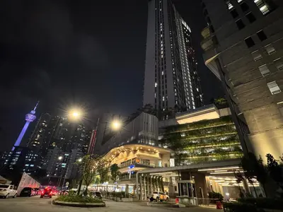 a city at night with a tall building at The Robertson S22 Jalan Alor Petaling Street Bukit Bintang KL 3R2B 8Pax in Kuala Lumpur