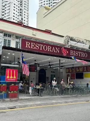 a restaurant with people sitting at tables in front of it at The Robertson S22 Jalan Alor Petaling Street Bukit Bintang KL 3R2B 8Pax in Kuala Lumpur