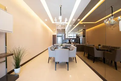 a dining room with a table and chairs at Dorsett Residence Kuala Lumpur 17 in Kuala Lumpur