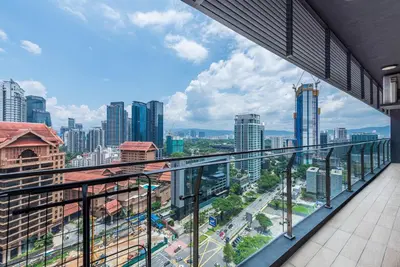 a balcony with a view of a city at Dorsett Residence Kuala Lumpur 17 in Kuala Lumpur