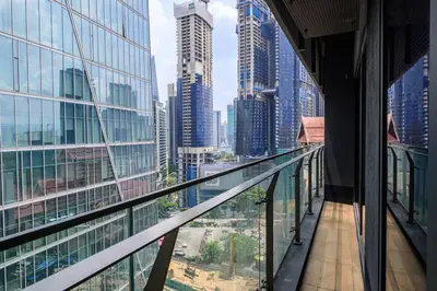 a balcony of a building with a view of a city at Dorsett Residence Kuala Lumpur 14 in Kuala Lumpur