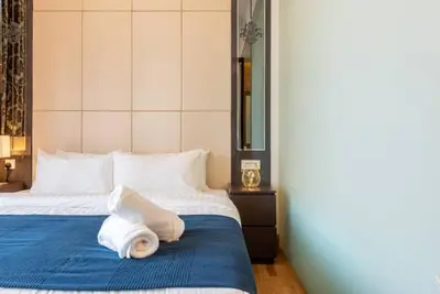 a hotel room with a bed with towels on it at Dorsett Residence Kuala Lumpur 12 in Kuala Lumpur