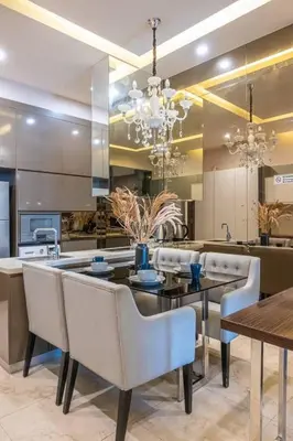 a dining room with a table and chairs and a kitchen at Dorsett residence Kuala Lumpur 19 in Kuala Lumpur