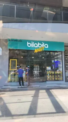 two people standing in front of a store window at The Nova by The City Collection in Kuala Lumpur