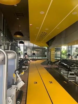 a gym with a yellow floor and rows of chairs at The Nova by The City Collection in Kuala Lumpur