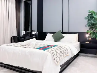 a bedroom with a large white bed in a room at Tropicana The Residence Onebedroom suite by VVHOMESTAY in Kuala Lumpur