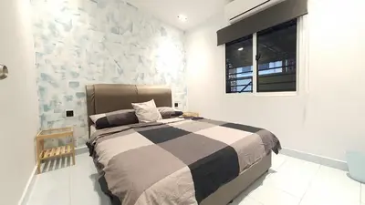a bedroom with a bed and a window in it at A Place Like Home Landed House Kuala Lumpur in Kuala Lumpur