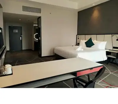 a hotel room with a bed and a desk at M101 Dang Wangi remote work-friendly suite in Kuala Lumpur