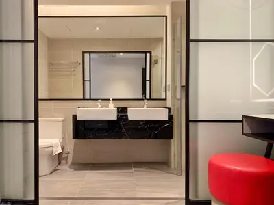 a bathroom with two sinks and a mirror at M101 Dang Wangi remote work-friendly suite in Kuala Lumpur
