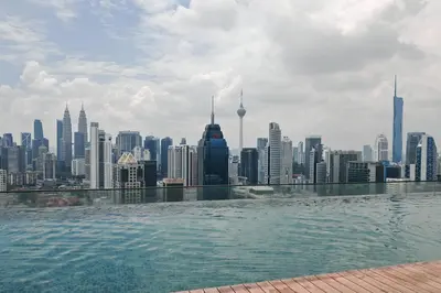 a view of a city skyline from a body of water at MyRehat Regalia Residences in Kuala Lumpur
