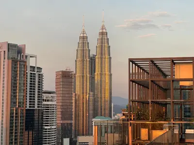 a view of the petronas towers in a city at Anggun KL Malaysia in Kuala Lumpur