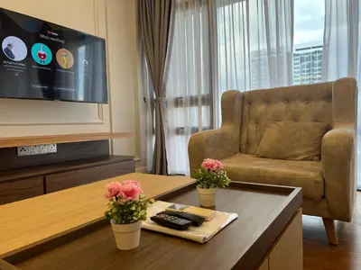 a living room with a couch and a table at Anggun KL Malaysia in Kuala Lumpur
