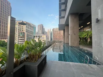a swimming pool on the roof of a building at Anggun KL Malaysia in Kuala Lumpur