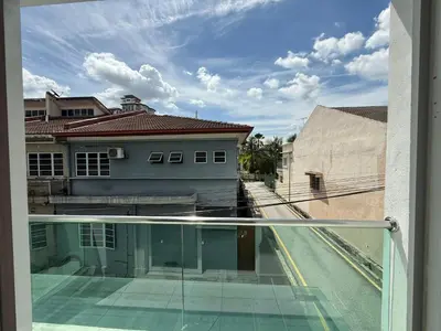 a balcony with a view of a building and a street at Prime Suite at Ampang - Individual Private Rooms in Kuala Lumpur
