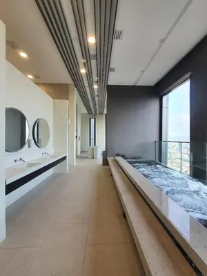 a large bathroom with a large bed and mirrors at Maxhome Cozy at Lucentia Bukit Bintang City Centre KL in Kuala Lumpur
