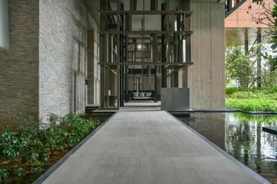 a hallway of a building with a walkway at Maxhome Cozy at Lucentia Bukit Bintang City Centre KL in Kuala Lumpur