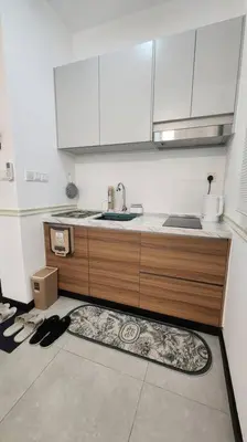a kitchen with a sink and a counter top at The Nova by The City Collection in Kuala Lumpur