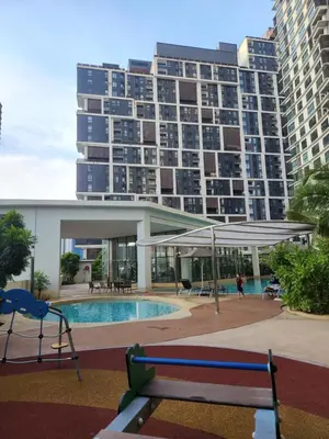 a large apartment building with a pool and a playground at Mont Kiara The Ooak Suites & Residences l 1BR in Kuala Lumpur