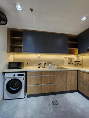 a kitchen with a dishwasher and a washing machine at Mont Kiara The Ooak Suites & Residences l 1BR in Kuala Lumpur