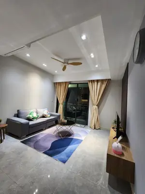 a living room with a couch and a ceiling fan at Mont Kiara The Ooak Suites & Residences l 1BR in Kuala Lumpur