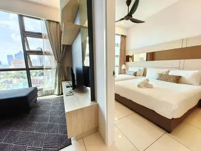a hotel room with a bed and a large window at MyCrib13*The Robertson KL - Bukit Bintang Pavilion in Kuala Lumpur