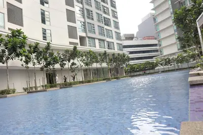a swimming pool in the middle of some buildings at MyCrib13*The Robertson KL - Bukit Bintang Pavilion in Kuala Lumpur