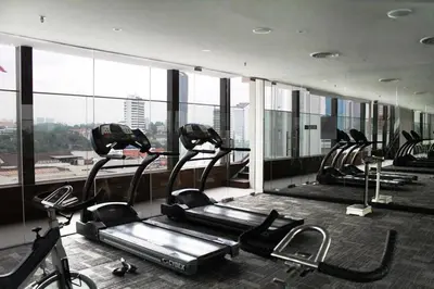 a gym with a bunch of tread machines in a building at Pacific Express Hotel Central Market Kuala Lumpur in Kuala Lumpur