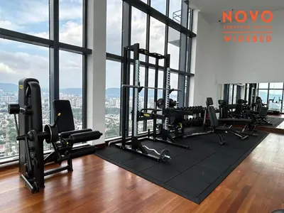 a gym with a bunch of treadmills and ellipticals at NOVO Serviced Suites by Widebed, Jalan Ampang, Gleneagles in Kuala Lumpur