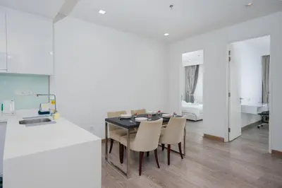 a kitchen and dining room with a table and chairs at MyRehat Suites Bukit Ceylon in Kuala Lumpur