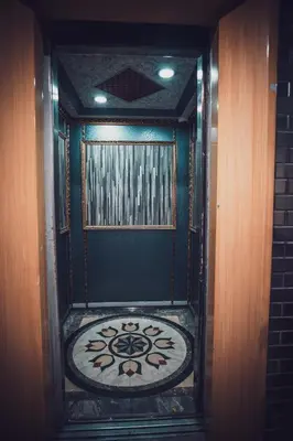 a room with a door with a tile floor and a window at Hotel Ambassador @ Bukit Bintang in Kuala Lumpur