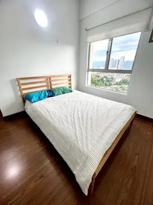 a bedroom with a large bed with a large window at Superb Maya Twin Tower View in Kuala Lumpur