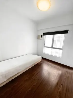 a white room with a bed and a window at Superb Maya Twin Tower View in Kuala Lumpur