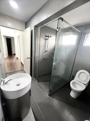 a bathroom with a shower and a toilet and a sink at Superb Maya Twin Tower View in Kuala Lumpur