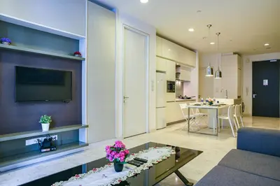 a living room with a couch and a table at Sidemen Suites at Platinum KLCC in Kuala Lumpur