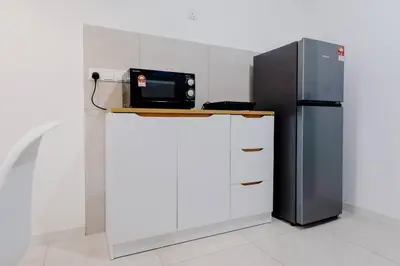 a kitchen with a microwave and a refrigerator at The Pano Residence Jalan Ipoh Insta-worthy Bath Tub Studio \u6d74\u7f38MRT in Kuala Lumpur