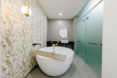 a bathroom with a large white tub and a mirror at The Pano Residence Jalan Ipoh Insta-worthy Bath Tub Studio \u6d74\u7f38MRT in Kuala Lumpur