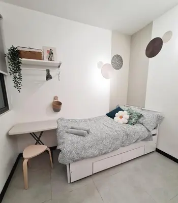 a small bedroom with a bed and a desk at Cozy 2R2B near Gleneagles @ Embassy Row KLCC in Kuala Lumpur