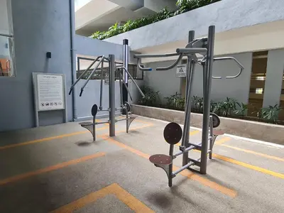 a row of gym equipment in a building at Cozy 2R2B near Gleneagles @ Embassy Row KLCC in Kuala Lumpur