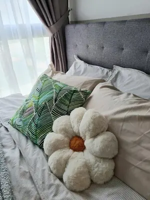 a teddy bear sitting on top of a bed at Cozy 2R2B near Gleneagles @ Embassy Row KLCC in Kuala Lumpur