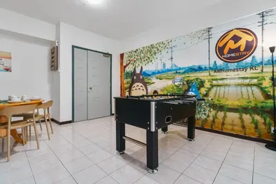 a room with a ping pong table and a mural at Plaza Berjaya Apt Bukit Bintang With Foosball in Kuala Lumpur