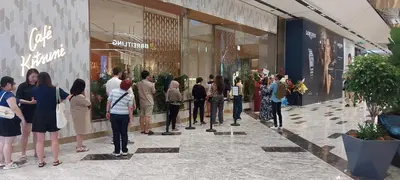 a group of people standing outside of a store at Plaza Berjaya Apt Bukit Bintang With Foosball in Kuala Lumpur
