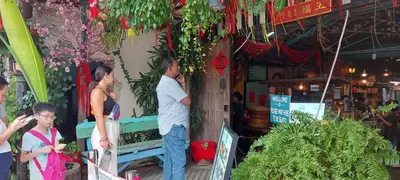 a group of people standing outside of a store at Plaza Berjaya Apt Bukit Bintang With Foosball in Kuala Lumpur